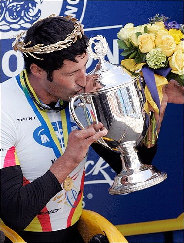 Van Dyk of South Africa kissed his trophy while on the podium.
