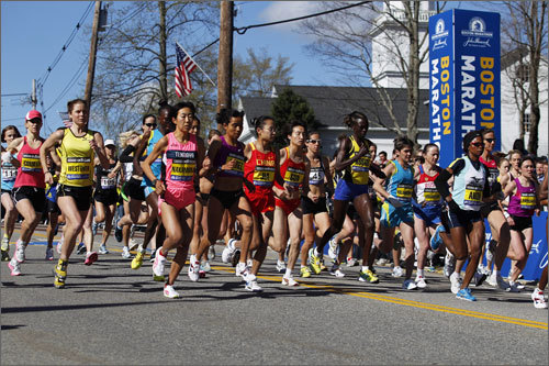Runners in the women's elite field begin to hit their stride shortly after starting the race. The top runners are expected to arrive at the finish line around noon.