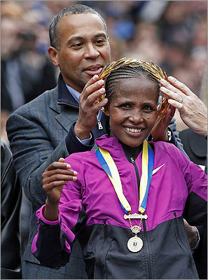 Governor Deval Patrick placed a laurel wreath on her head.