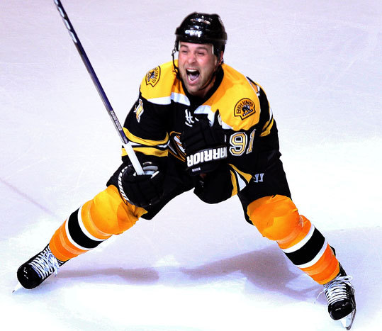 Boston Bruins center Marc Savard (91) reacted after scoring the game-winning goal in OT.