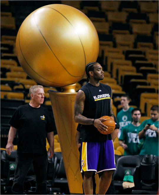 The Lakers' Josh Powell warmed up before Game 3 in front of a giant replica of the NBA championship trophy.