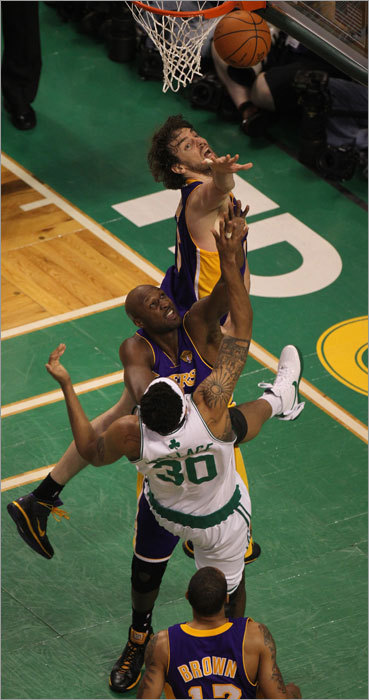 The Celtics' Rasheed Wallace (right) reached for a rebound in the second half, with a group of Lakers also contending for it.