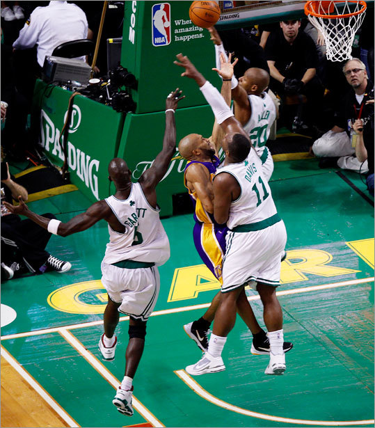 Lakers guard Derek Fisher had a key late drive to the basket against the defense of Ray Allen, Kevin Garnett, and Glen Davis. Fisher scored and was fouled by Davis to help keep the Lakers in control of the game.