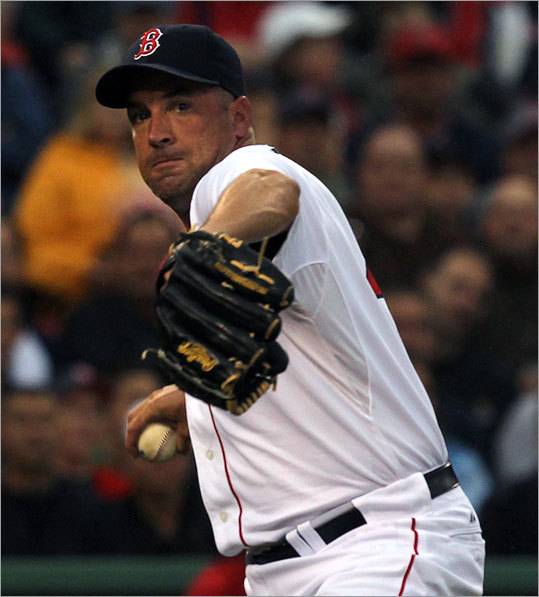 Boston Red Sox relief pitcher Scott Atchison (48) threw to first base in time for an out in the second inning.