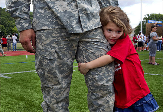 Caitline Paquette, 4, said goodbye to her uncle, Ryan Buckert, at the send-off ceremony today at Foley Stadium in Worcester. With the more than 650 soldiers deployed today, the Massachusetts National Guard's commitment is its highest since World War II. More than 1,200 soldiers from Massachusetts serve in Iraq and Afghanistan. This deployment brings the number to nearly 1,900.