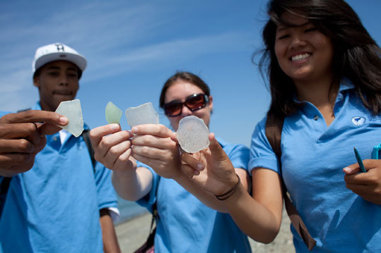 Spectacle Island, a Boston landfill until 1950, has become one of the world’s best troves of sea glass. Beginning today, a conservation group plans to make the island and its gleaming treasure a classroom. Pictured: BJ Clark, Carolyn Burkett and Thi Tran, youth workers from Save the Harbor/Save the Bay, collected sea glass and artifacts on the beach from the island's days as a dump.