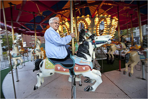 “You’d be amazed how much elderly women come down to here to use it,’’ said operator Patricia Richardson. In this photo, Irene Army, 95, enjoyed a ride on the carousel.
