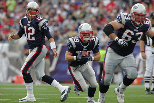 Tom Brady handed the ball off to Danny Woodhead, who ran behind Dan Connolly en route to a 20-yard rushing touchdown against the Buffalo Bills in the second quarter. Woodhead's unlikely touchdown was part of a New England offensive onslaught that helped the Patriots outscore Buffalo 38-30 Sunday afternoon.