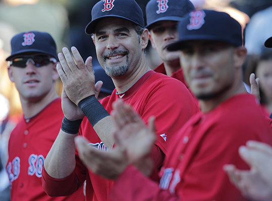Red Sox Mike Lowell smiled and applauded during his retirement ceremony before the Red Sox played the Yankees at Fenway Park.