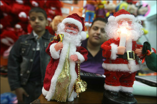 Iraq Iraqi boys looked at Santa Claus toys at a shop selling Christmas decorations in Baghdad.