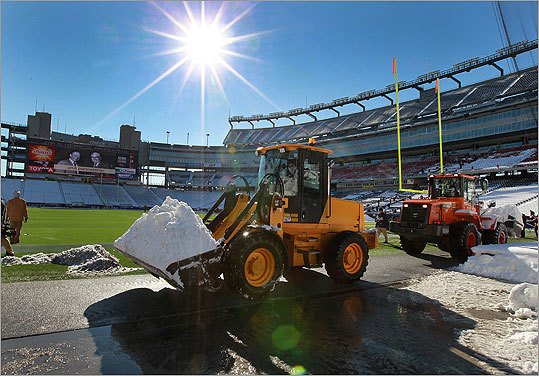 Snow removal was underway inside Gillette Stadium as crews worked to prepare for Sunday's playoff game against the New York Jets.
