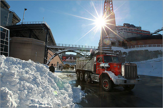 Trucks hauled away snow from Gillette Stadium.