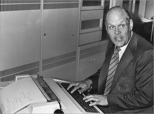 Digital entered the Fortune 500 for the first time in 1974. Pictured here: Founder Ken Olsen from 1977 using one of the company's newest pieces of machinery at a stockholders meeting at the John Hancock Tower.
