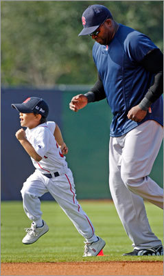 David 'Big Papi' Ortiz trailed his son D'Angelo (wearing a hat with 'Lil Papi' embroidered on it), who joined his dad and his teammates for the exercises before batting practice.