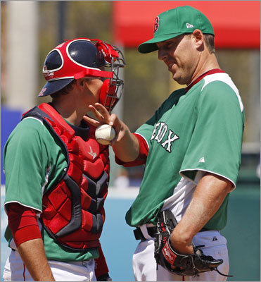 Starter John Lackey (right) talked with catcher Paul Hoover on a trip to the mound in the third inning on St. Patrick's Day. Lackey allowed one run on five hits and one walk over 5 1/3 innings in an 8-5 victory.