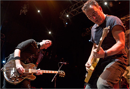 Springsteen and Tim Brennan played their guitars.