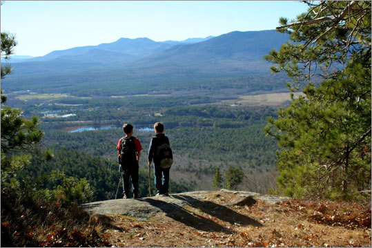 Green Hills A 4,222-acre Nature Conservancy preserve minutes from the outlet stores of North Conway, N.H., the Green Hills feature rare plants and spectacular views of the Mount Washington Valley. Snow-free when surrounding ridges cling to winter, the preserve combines challenging terrain with relaxing jaunts through picturesque forests. Hike: Embark on the 4.2-mile round-trip hike to 1,793-foot Peaked Mountain on a woods road that leads across municipal parkland. Bear left to reach the nature preserve and the start of a loop. Hike clockwise along the Peaked Mountain, Middle Mountain Connector, and Middle Mountain trails before returning to the start. Trailhead: Located in North Conway on Thompson Road, 0.3 mile off of Artist Falls Road.