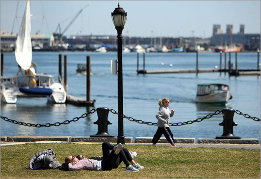 The temperature rose into the high 50's in Boston on Saturday, bringing residents and visitors alike outside to enjoy the city. These people found time to exercise along the water in the North End's Christopher Columbus Park.