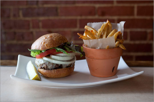 Along the Maine coast, there are a number of restaurants that offer personal service with inventive cuisine. At left, the bistro burger at Lily Bistro in Rockland. The burger is made with Caldwell Farms beef, and served with farmers greens, tomato pickle, and hand-cut frites. Read: Small food, big chefs