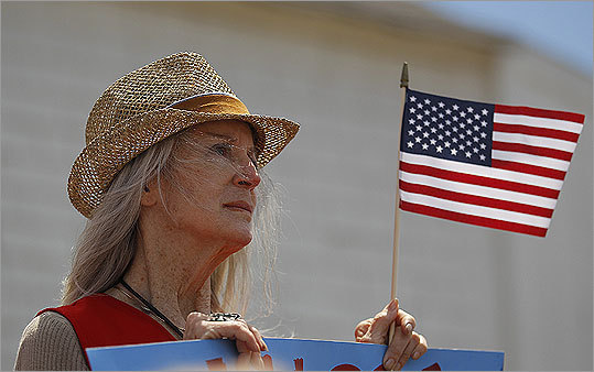 A supporter listened to Romney's presidential announcement.