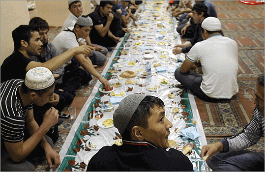 Russia Russian Muslims sat down in a line for a meal after prayers on the first day of Ramadan in a local mosque in Moscow.