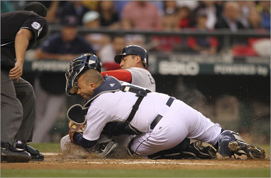 Aug. 13: Mariners 5, Red Sox 4 Jacoby Ellsbury (top) slid into home while Mariners catcher Josh Bard tried to block the plate in the fourth inning. Ellsbury was eventually called out.