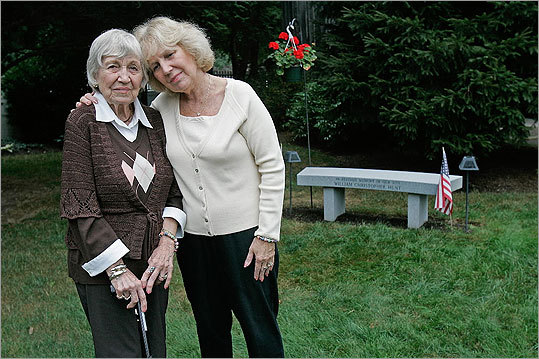 From left, Lorraine Condon Knorr, grandmother to 9/11 victim William Christopher Hunt, and Diane Hunt, his mother, stand near a garden that was created in William's honor. The bench in her Kingston backyard was provided by the South Shore chapter of the American Red Cross. William Hunt has several memorials in Kingston: A flag of honor and a plaque were donated to Kingston Town Hall, and Sacred Heart High School planted two cherry trees in his honor.