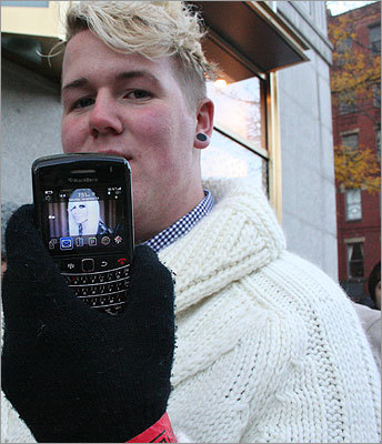 Elvin, 18, of West Roxbury, showed off his Donatella Versace phone background, referring to her as the 'female Jesus.' Elvin planned to buy everything that he could get his hands on.