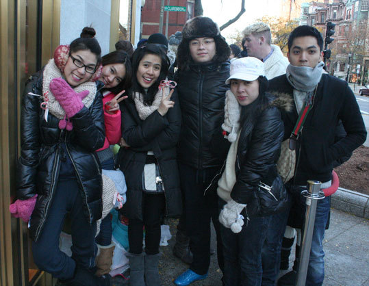 A group of Suffolk and Northeastern University students guarded the first spot in line. Son Nguyen, 20, (center) said the six friends had been waiting since 7 a.m. on Friday. Their car was parked out front if they needed to leave to go to the bathroom or get food from their Beacon Hill apartment but, most of them stayed the entire 24 hours, not sleeping. 'We love the collection,' Quynh Pham, 19, (left) said. From left to right; Quynh Pham, Thao Dang, Thu Nguyen, Son Nguyen, Bich Pham and Tien Nguyen.