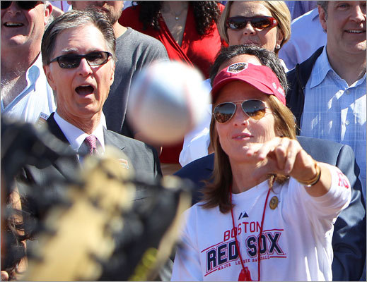 Caroline Kennedy, right, threw out the first pitch with Mayor Thomas M. Menino (not pictured), and Thomas Fitzgerald (not pictured) for Fenway Park's 100th anniversary. Red Sox owner John Henry looked on from the left. Kennedy and Fitzgerald are great-grandchildren of former Boston Mayor John 'Honey Fitz' Fitzgerald, who threw out the first pitch in 1912.