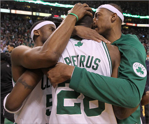 Paul Pierce (23 points) and Keyon Dooling (10 points off the bench) celebrated a 93-91 overtime win with Mickael Pietrus.