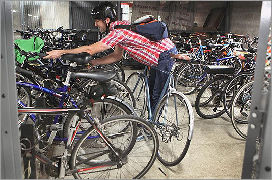 Software engineer Mike Reed stored his bicycle in a secure cage inside a Kendall Square parking garage.