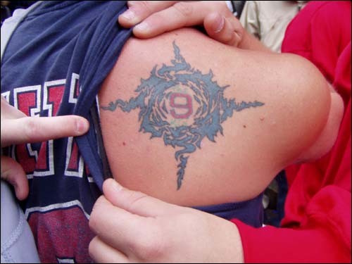 Fans show their Red Sox pride. Kurt Wetterlow shows off his tattoo, 