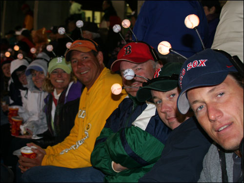 But is anybody home? These fun-loving fans from York and Ogunquit, Maine were trying to start another new fashion craze. While a couple of them were lit up, they had a few dim bulbs among them as well.