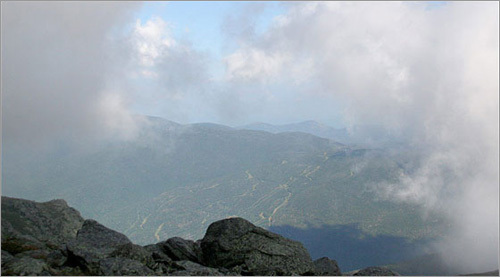 As we hiked, the clouds would occasionally part and taunt us with a momentary view, but the views were all short-lived.