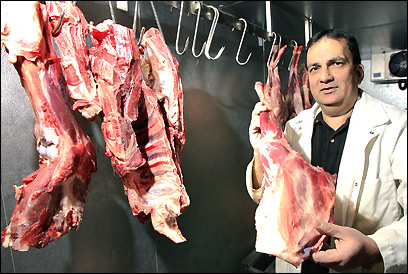 Aftab Ahmed displays a halal leg of lamb