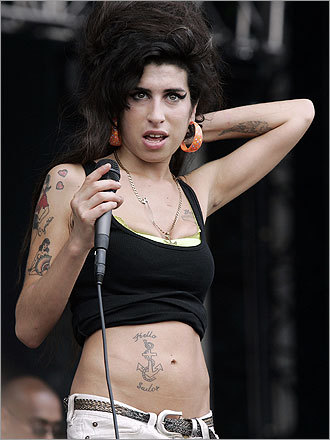 Just one of her many tattoos, British singer (and Grammy winner) Amy 