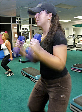 Crystal Trainer of Tyngsboro works out during a bridal boot camp at Yolandas in Waltham. Yolanda's operates six-week bootcamps year round. Three days a week 10 brides work out in the store's basement fitness center, sometimes with their mothers, bridesmaids, and occasionally their grooms.