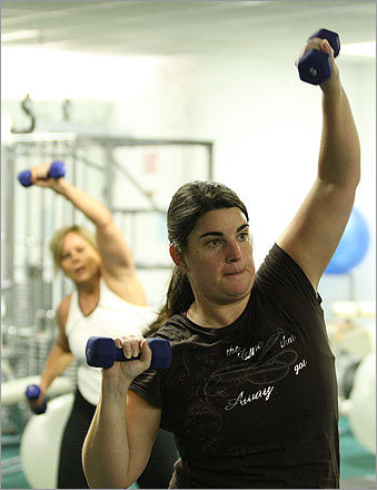 Laurie Harris of Woburn takes a bootcamp class at Yolandas in Waltham. Whatever's behind it, working out in a group in which everyone has the goal -- looking svelt and gorgeous on the big day -- is extremely motivating, Everett said.