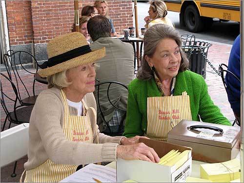 'It's going very well,' said club publicity chairwoman Ginger Lawrence, shortly after 1 p.m. on tour day. She noted that many people wait until the day of the tour to buy tickets because of the unpredictability of the weather. (At left, garden club members sold tickets on Charles Street on the day of the tour.)