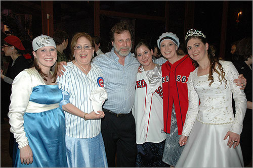 Avital's wedding Neal and Miki Hauser with their four daughters (from left): Yonina Hauser-Kfir, Miki Hauser, Neal Hauser, Ayelet Hauser, Yael Hauser-Levontin, and the bride Avital Hauser-Moshe, at Avital's wedding last March in Israel. 'As can be seen, Red Sox genes run strong in the family,' she writes.