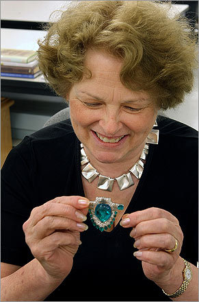 Yvonne Markowitz, the new jewelry curator at the MFA and the woman behind the Art Nouveau Jewelry show opening there July 23, is the first jewelry curator in the country. She is holding a platinum diamond emerald jewelry piece that belonged to Marjorie Merriweather Post.