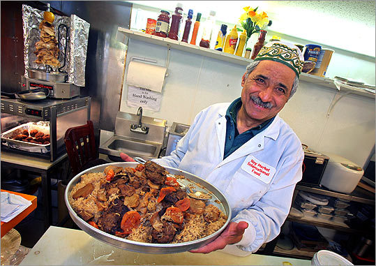 Adib Kabbani with a dish at Haymarket International Food.