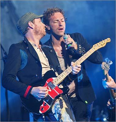 In 2003, Paltrow married Coldplay lead singer Chris Martin (right) after meeting him at one of his band's performances. The band's guitarist Jonny Buckland (left) is the godfather of the couple's first child, Apple. They also have a son, Moses.