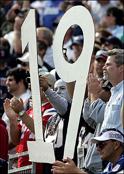 As this fan's sign shows, the New England Patriots defeated the Miami Dolphins on Sunday at Gillette Stadium to win their 19th consecutive game and become the sole owner of the NFL's longest winning streak.
