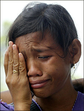 An Acehnese child cries after not finding information about her parents at a missing-persons information center in the provincial Indonesian capital of Banda Aceh.