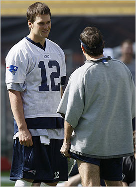 Patriots coach Bill Belichick talked to Brady during practice.