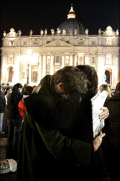 A couple embraced in Saint Peter's Square after hearing news that Pope John Paul II had died at the Vatican Saturday. The news was immediately announced to around 60,000 gathered in Saint Peter's Square and was met with a long applause, an Italian sign of respect. Bells tolled and many people wept openly.