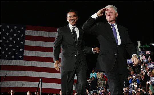 Barack Obama takes the stage with former President Bill Clinton at a campaign rally in Kissimmee, Florida.