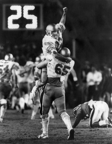 Former Boston College quarterback Doug Flutie threw the legendary Hail Mary pass to receiver Gerard Phelan to give the Eagles a thrilling 47-45 last-second win over the University of Miami on Nov. 23, 1984. In an interview with ESPN's Brent Musburger on the 25th anniversary of the pass, Flutie said it's a rare day when the Hail Mary is not brought up in conversation. 'I know the average is well over once a day,' he told Musburger. 'There may be a day that goes by where it doesn't come up, but they're few and far between.' Here's a look back at Doug Flutie through the years.